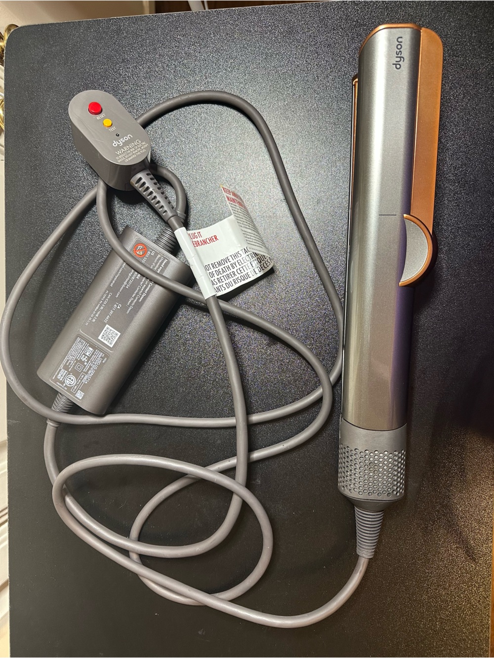 Dyson Airstrait.  Great + condition. Dries and straightens. Less frizz.